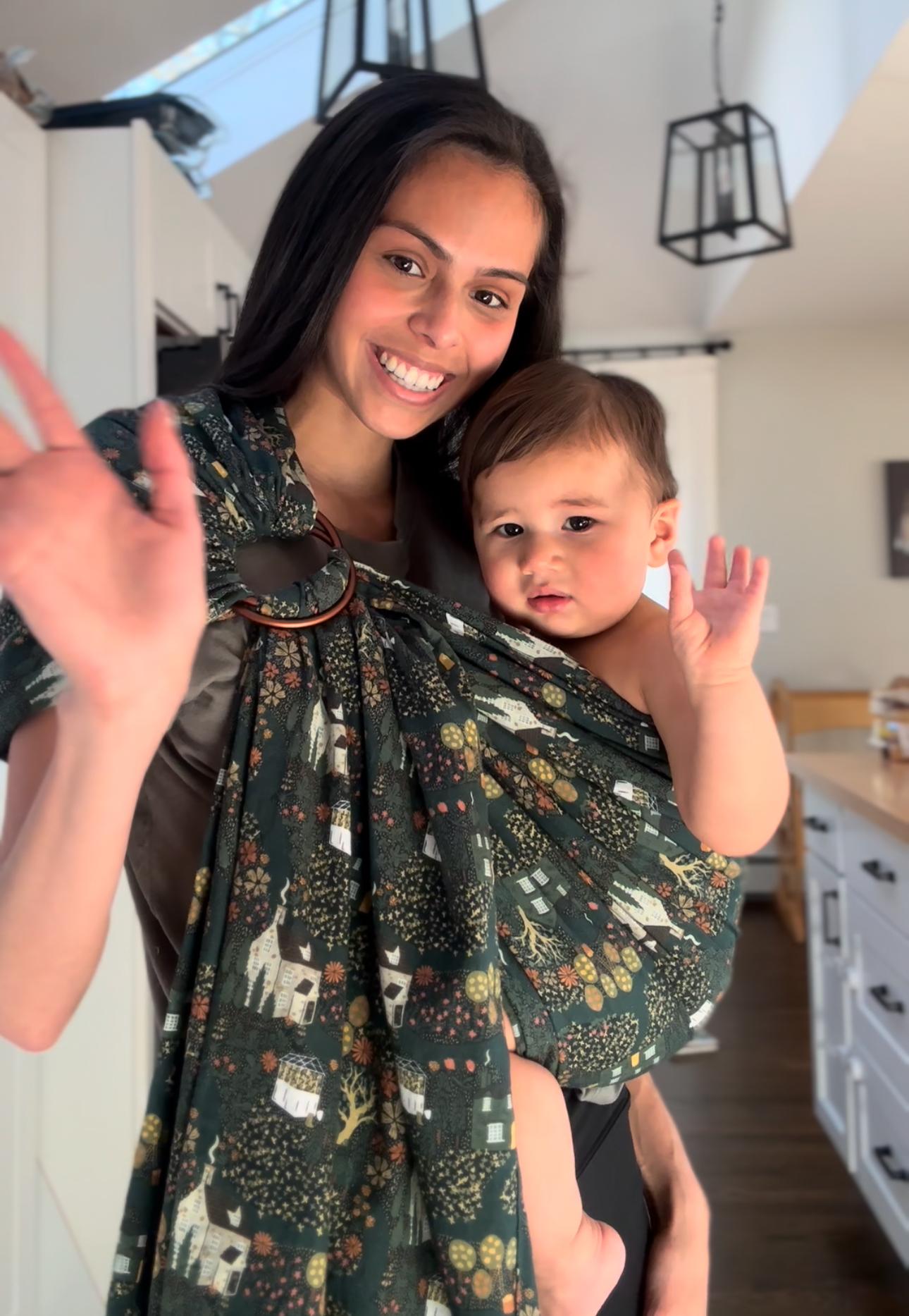 Daniela wearing the Village Ring Sling with her toddler