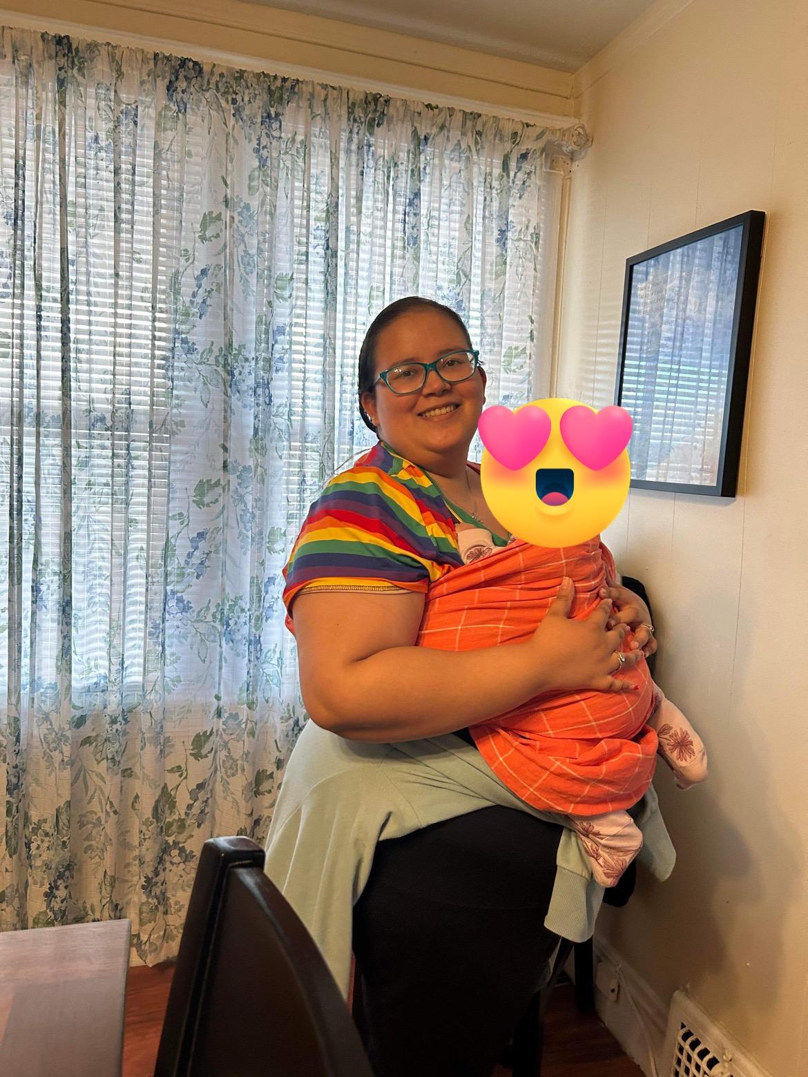 Plus-size couple both wearing hope&plum ring slings with their baby